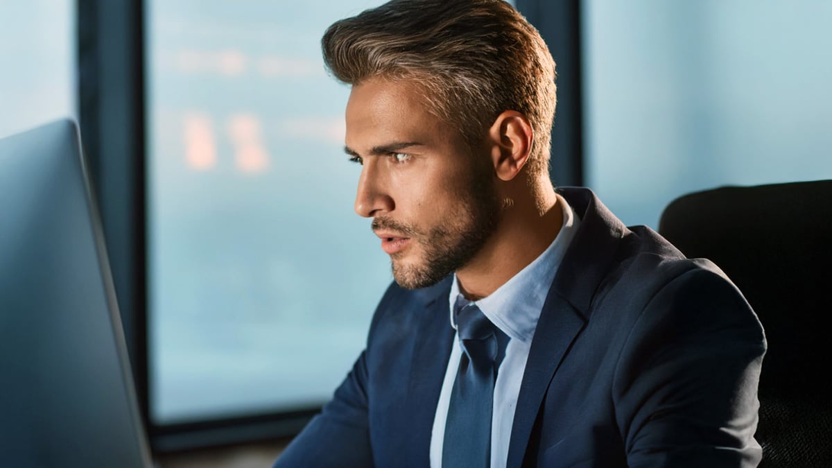 Business professional working intensely at computer