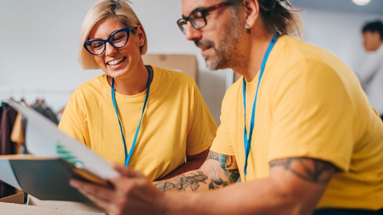 Two social work students reviewing documents together during a professional placement