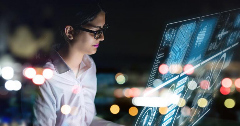 Professional woman with analytics screen