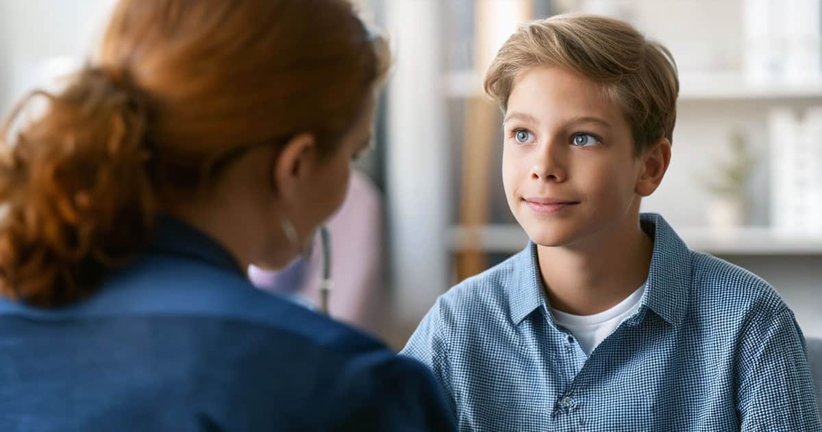 Boy speaking with professional