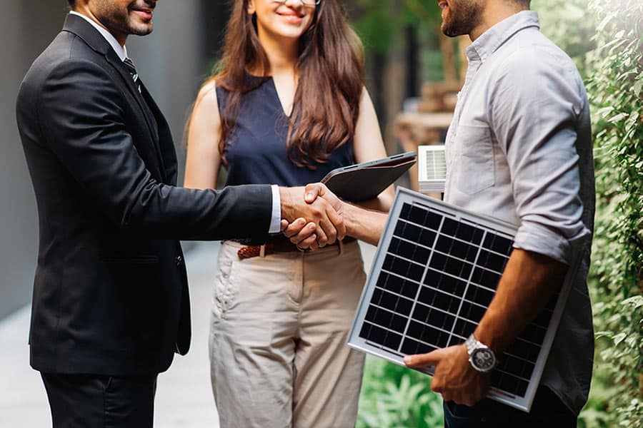 Business people meeting outside and shaking hands