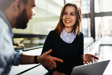 Friendly discussion between business man and woman