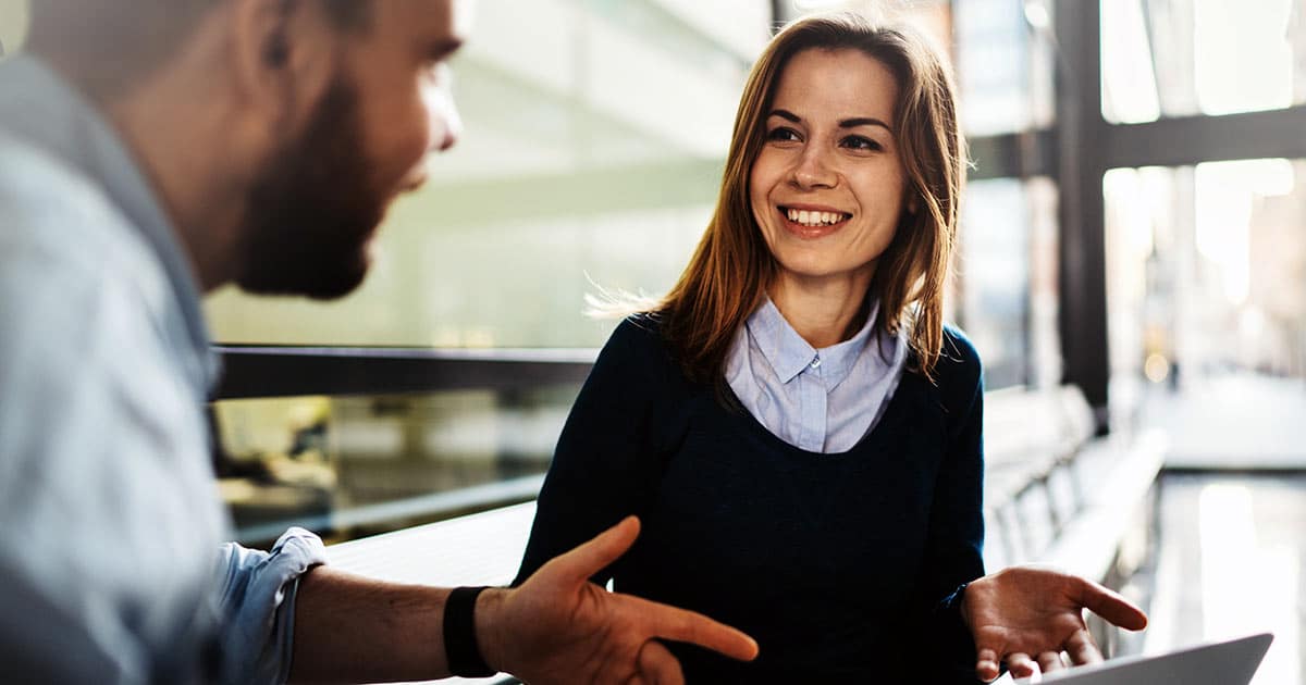 Work colleagues engaged in friendly discussion