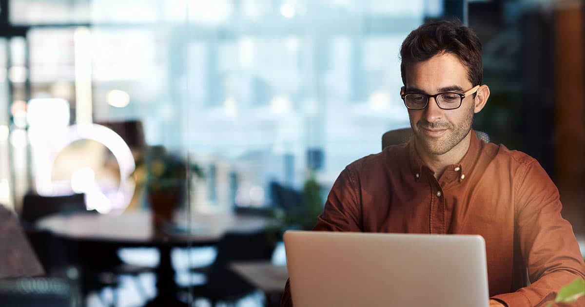 Businessman working late on laptop