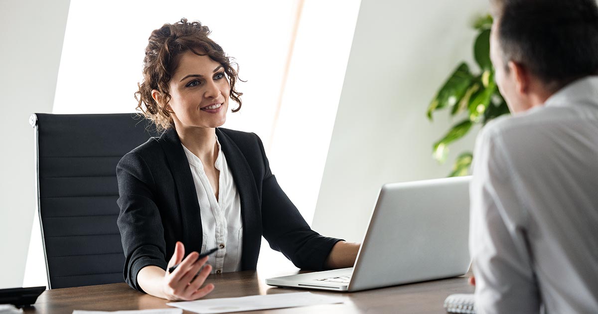 Female executive meeting with professional man in office