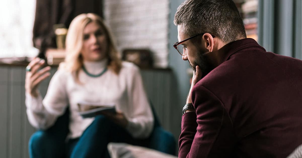 Counselling or therapy session between man and woman