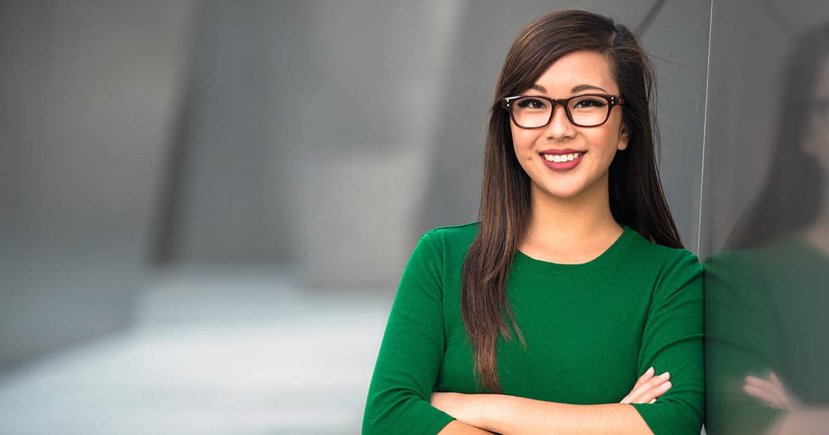 Confident, smiling Asian woman with glasses