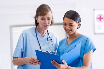 Doctor and nurse reviewing patient file