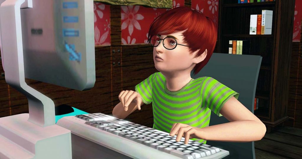 Teenage male using computer at home