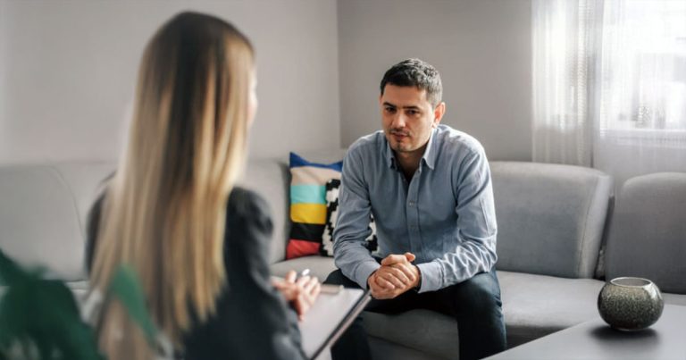 Female counsellor with male client