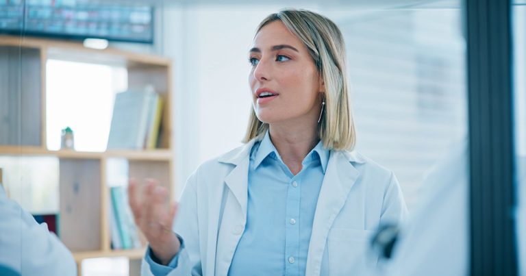 Female health professional in standing discussion
