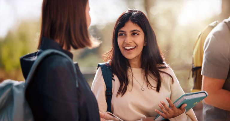 Female uni student smiling in group