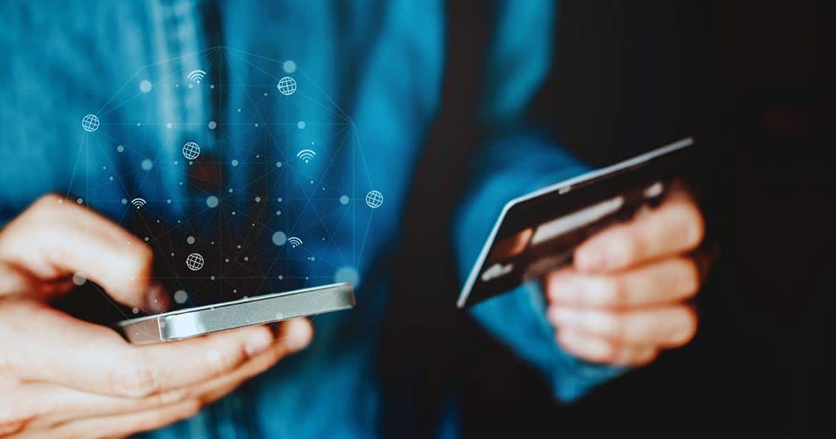 Man using a credit card for payment on phone