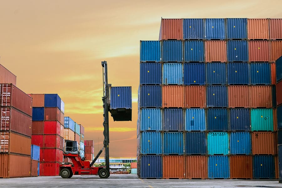 Forklift stacking shipping containers