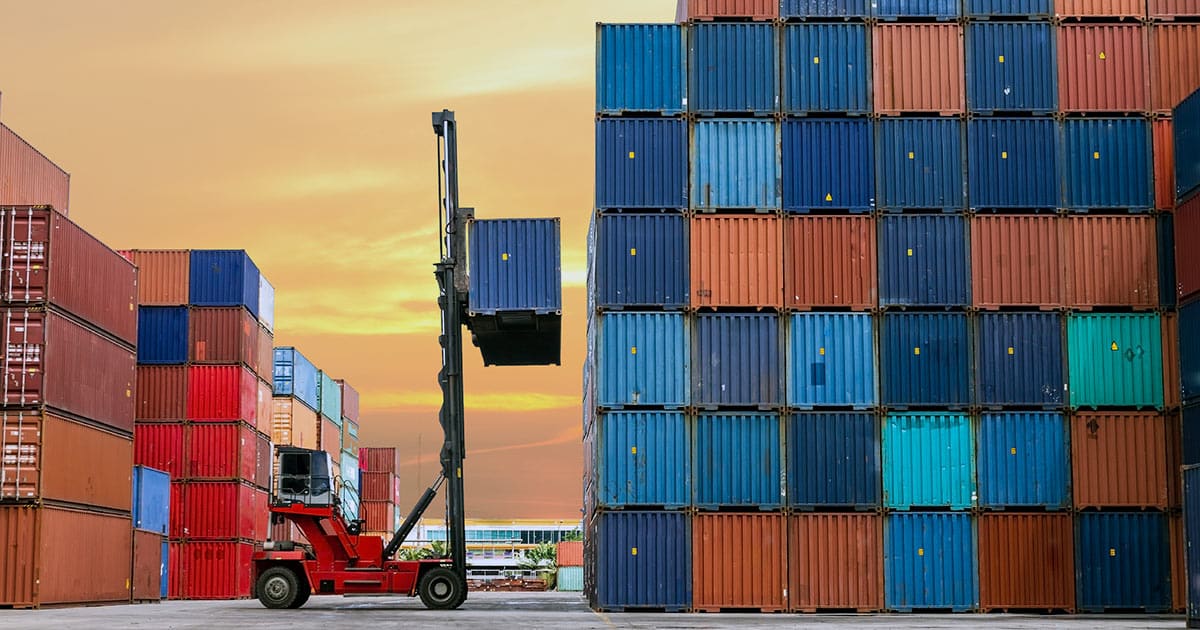 Forklift stacking shipping containers