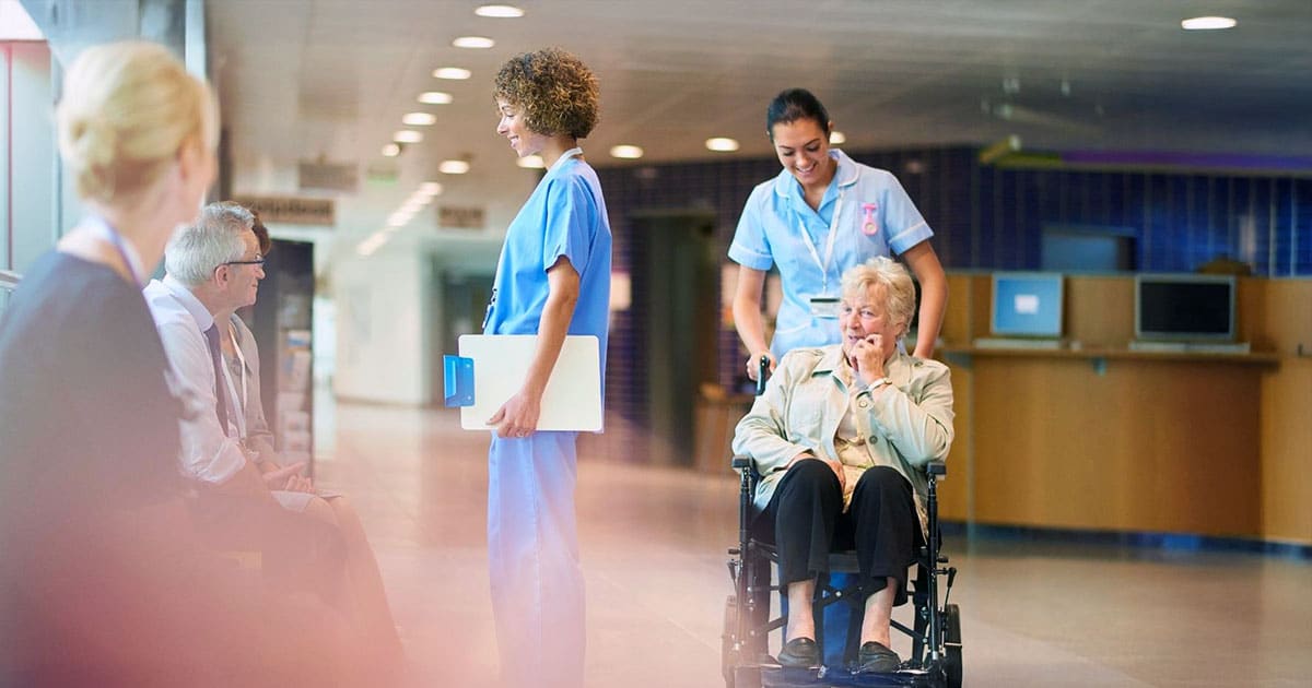 Hospital ward with nurses and patients