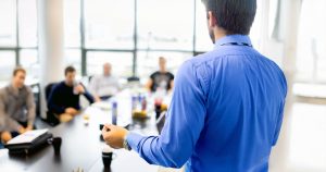 Male professional giving presentation
