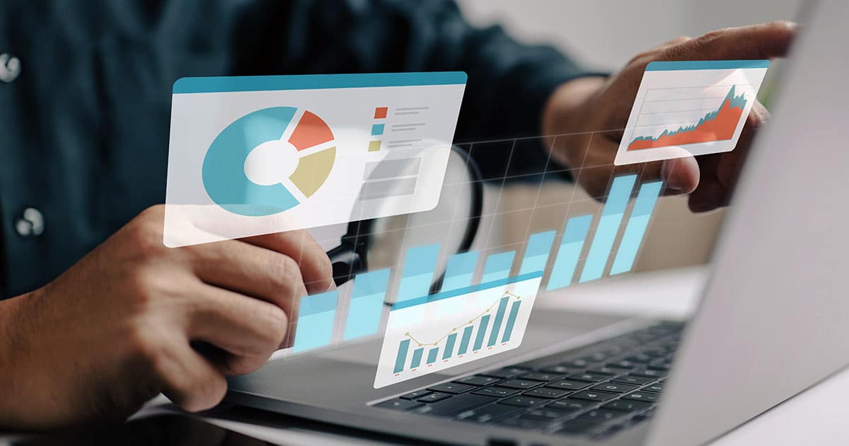 Man generating charts and statistical analysis on a laptop