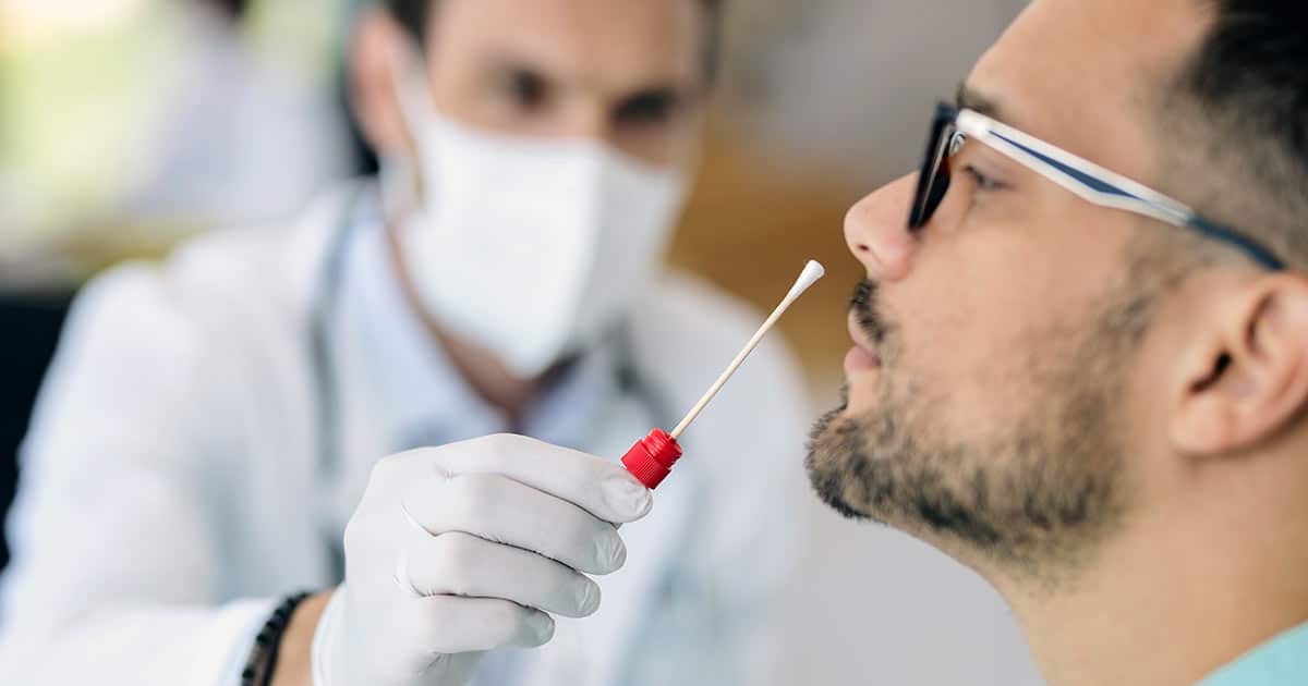 Man having a PCR test at a medical clinic