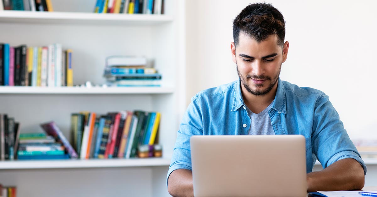 University student studying on laptop