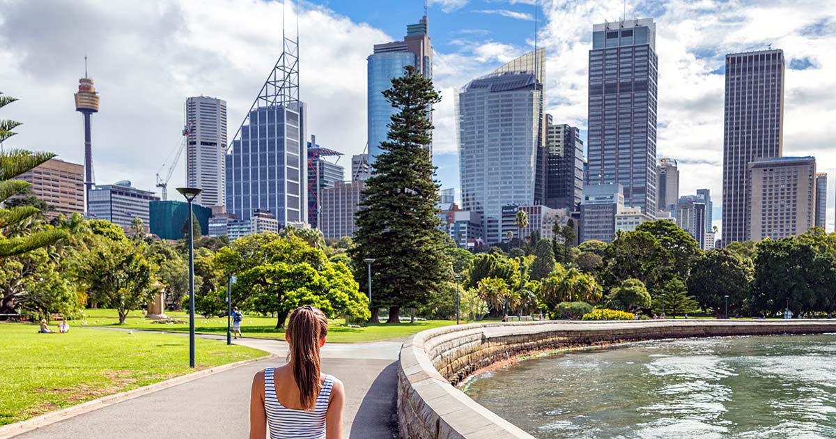 Woman observing the skyline of the Sydney central business district