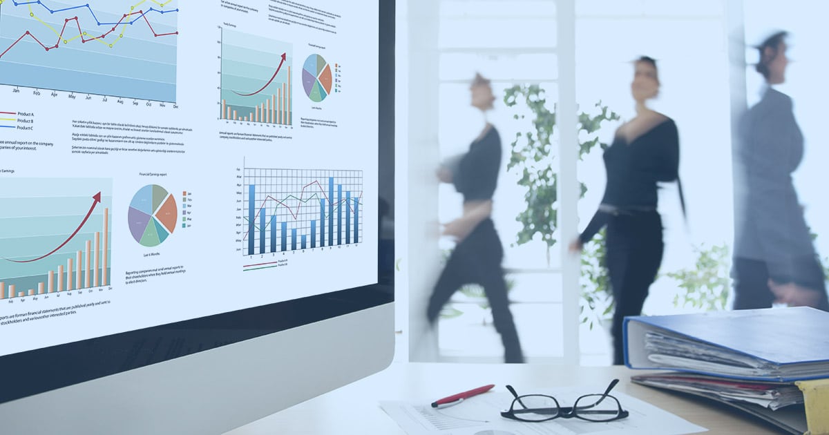 Statistical charts highlighted on screen in a busy office area