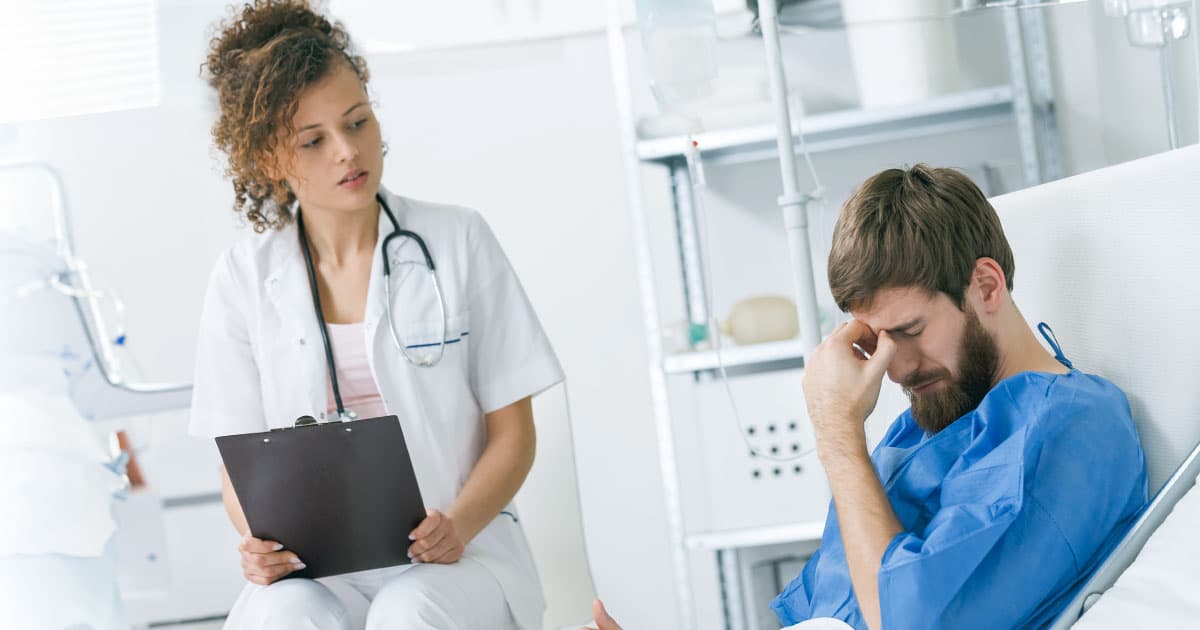 Medical professional with disconsolate patient