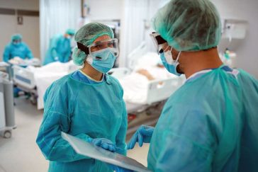 Medical professionals in acute care ward