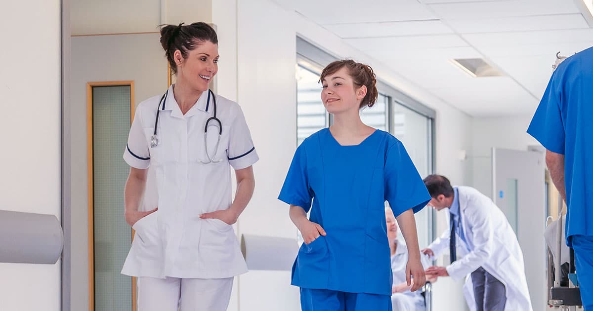 Medical staff walking through hospital