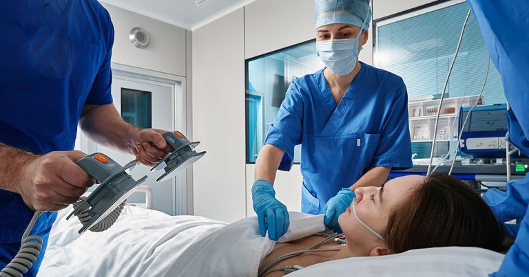 Medical team performing resuscitation in ICU