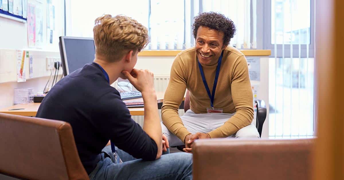 Consultation between professional man and an adolescent or young man