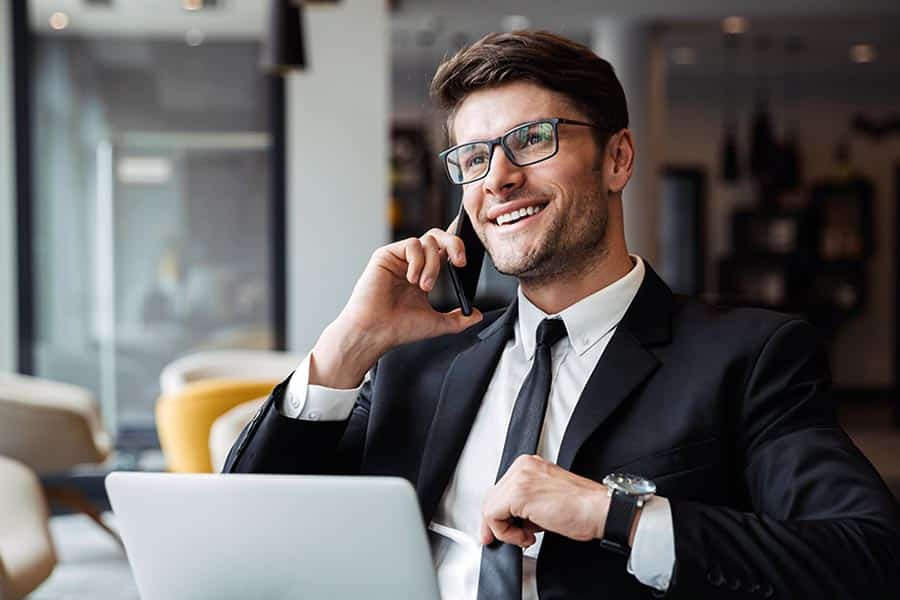 Businessman smiling while on phone