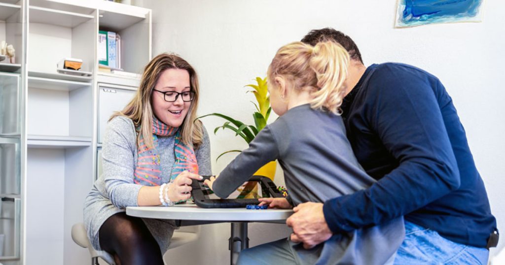 Neuropsychologist with young patient