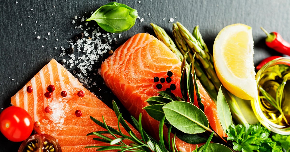 Salmon and complementary ingredients on slate