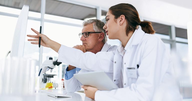 Professionals reviewing analysis in lab or clinical setting