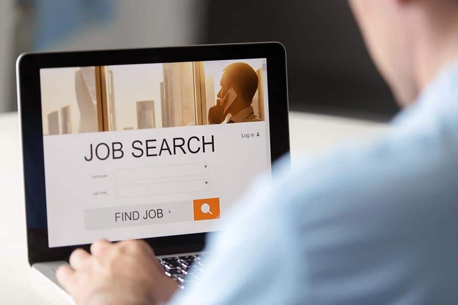 Man on page showing job search and find a job options on laptop
