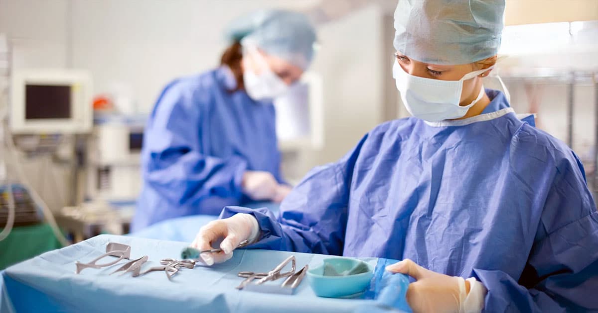 Registered Nurse (Perioperative) with surgical instruments