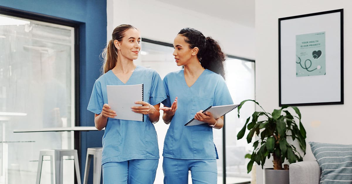 Registered nurses walking in hospital