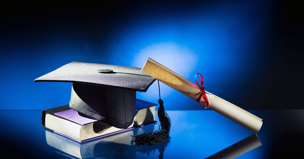 University degree with graduation cap and testamur
