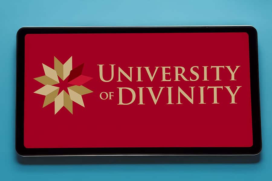 University of Divinity logo on tablet