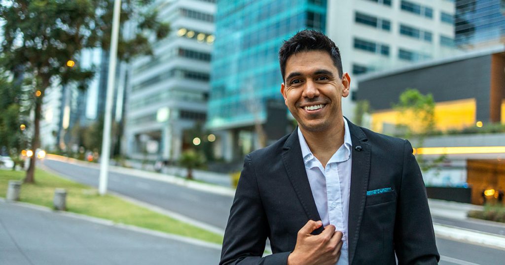 Young man wearing a business suit on a city street