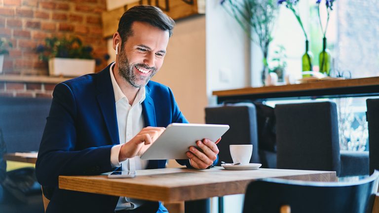 Business professional using analytics on a tablet to support decision making