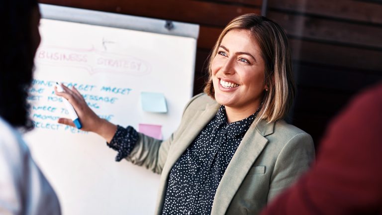 HR professional presenting business strategy to colleagues