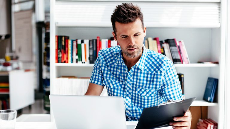 Online learner studying with a laptop and tablet