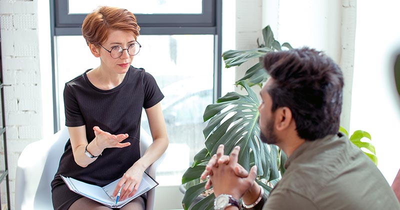 Consultation between man and woman in office