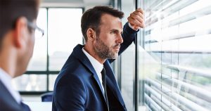 Businessman looking out window