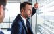 Businessman looking out window