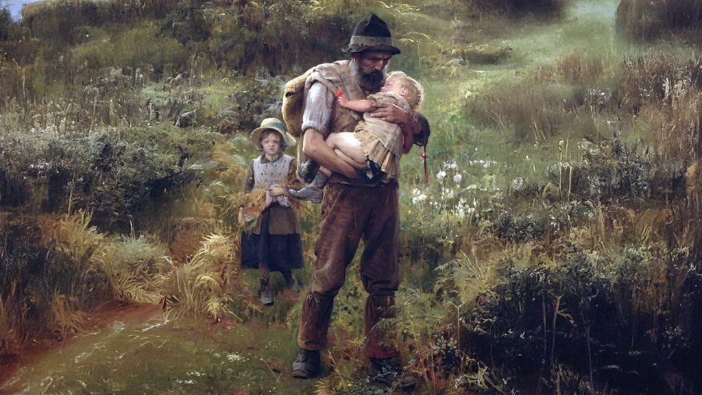 Father carrying child in countryside