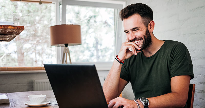 Man taking online classes at home.