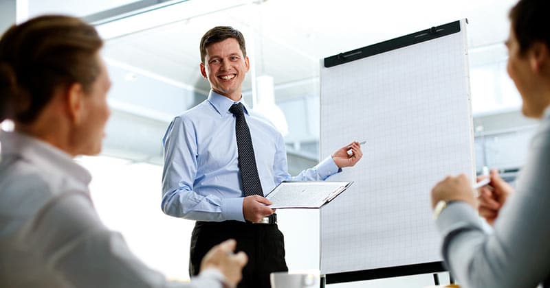 Business man doing a presentation to work colleagues